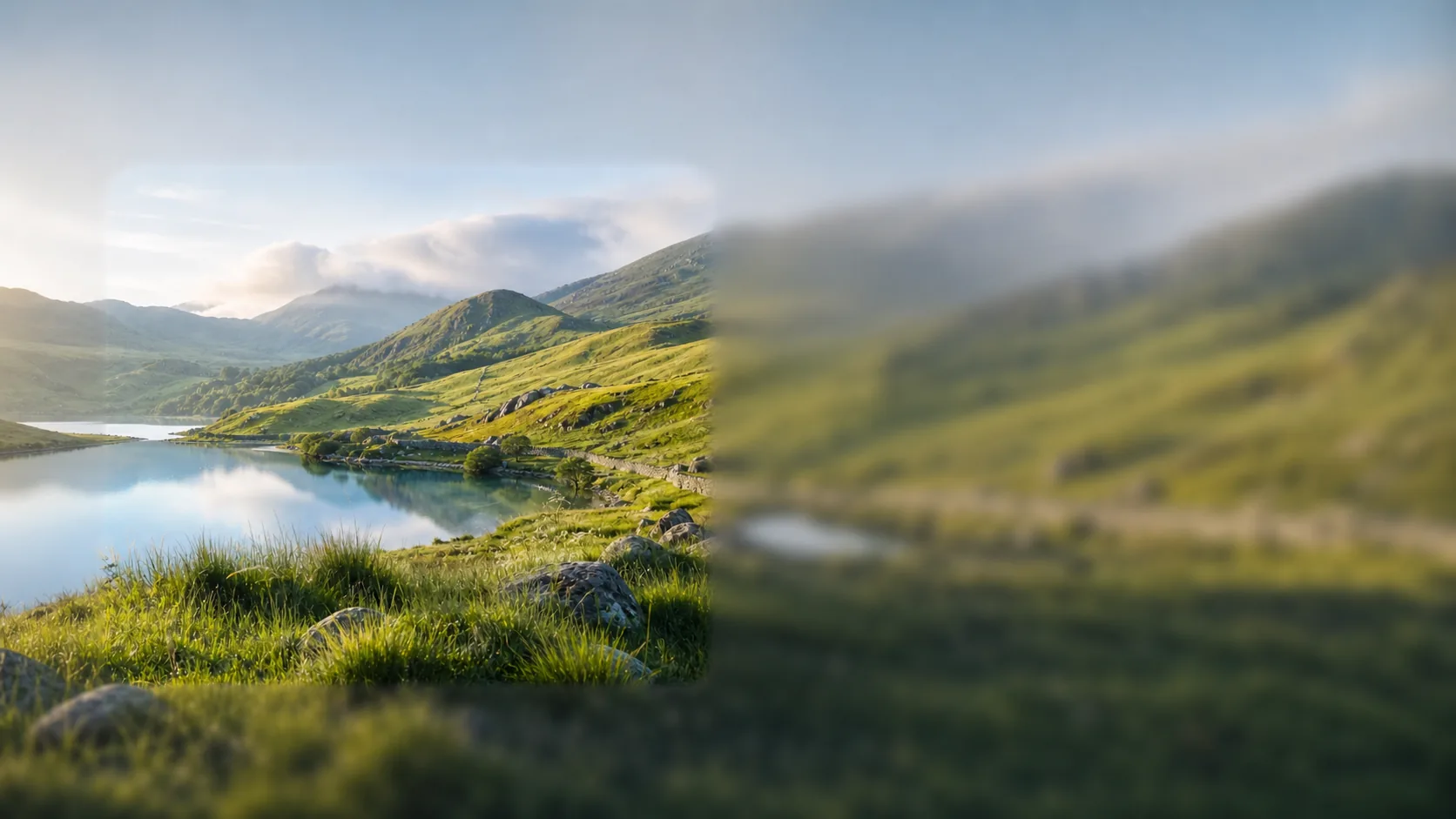 A sunlit Welsh mountain lake with a clear area surrounded by soft focus